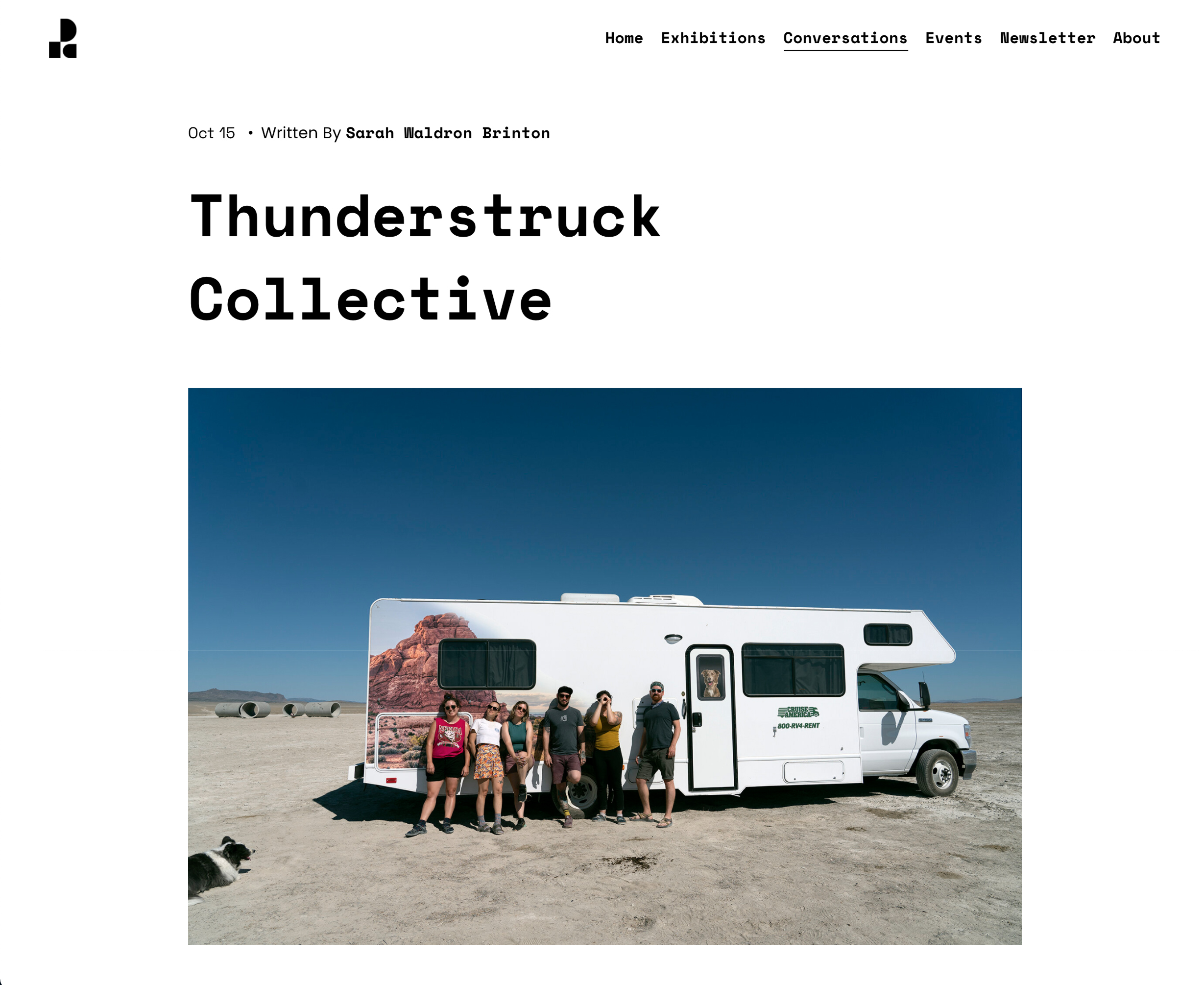 Image of group of individuals standing in front of rv in the Utah desert